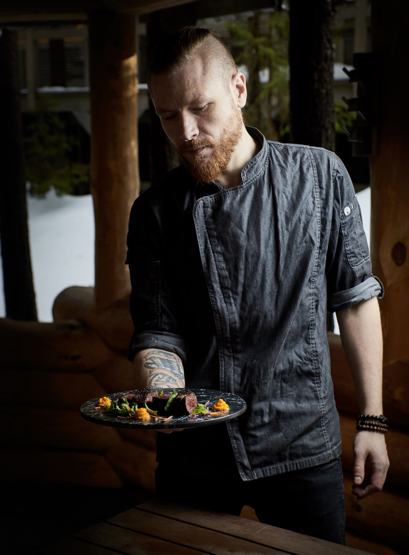 Chef holding plate Dominic Scott